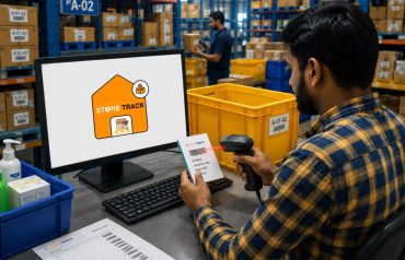 Warehouse employee scanning products using StoreTrack barcode system.